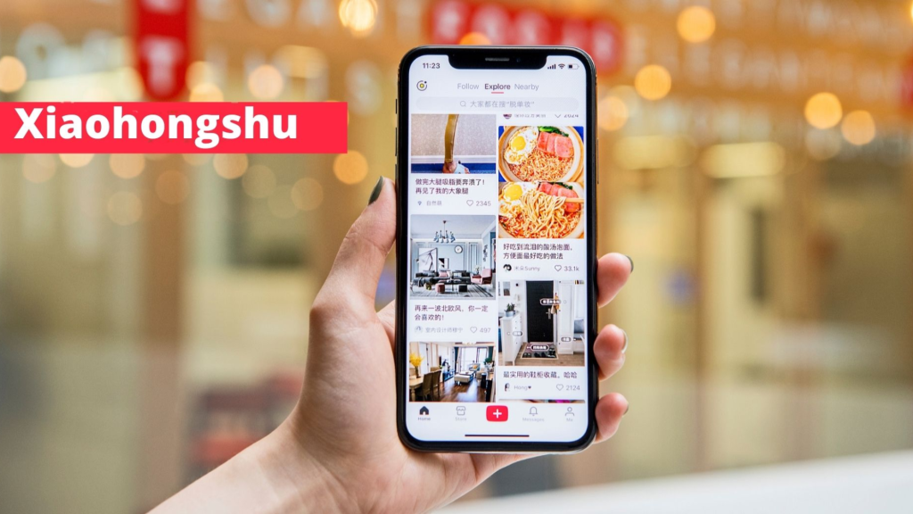 Smartphone displaying Little Redbook Marketing on Xiaohongshu app with lifestyle and product posts.
