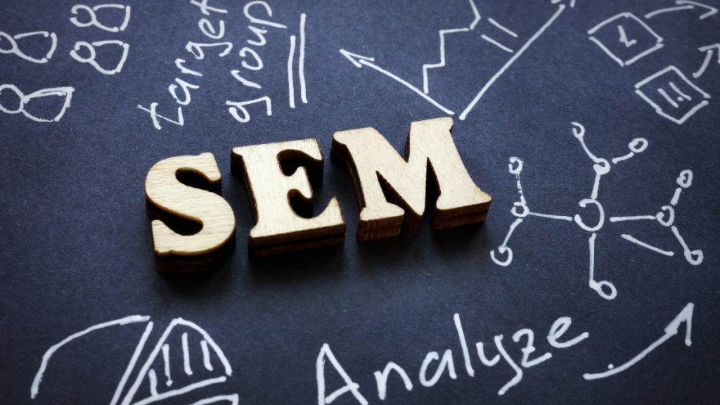 Wooden 'SEM' letters on a diagram for Search Engine Marketing KL strategy.