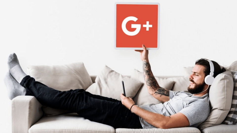 Man with headphones holding Google Plus icon, symbolizing Google Ads (SEM).