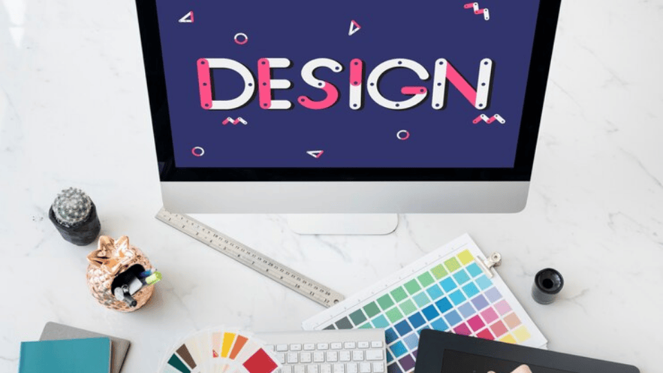 Workstation with design tools and a screen displaying 'Design,' showcasing KL Logo Design.